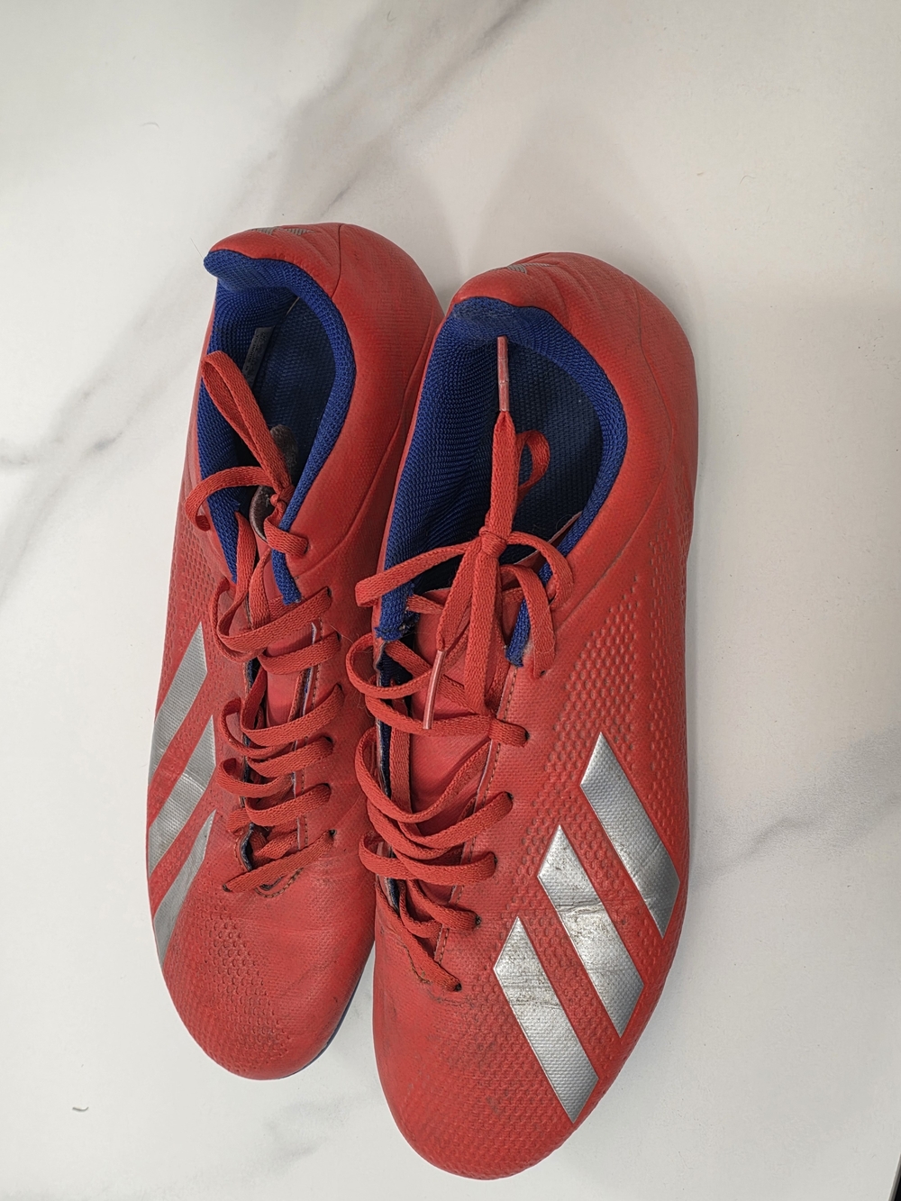 Red Cleats with Silver Stripes